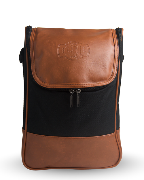 Bolso matero negro y café de eco cuero, foto principal sobre fondo blanco